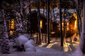 glowing muskoka cottage in a winter wonderland
